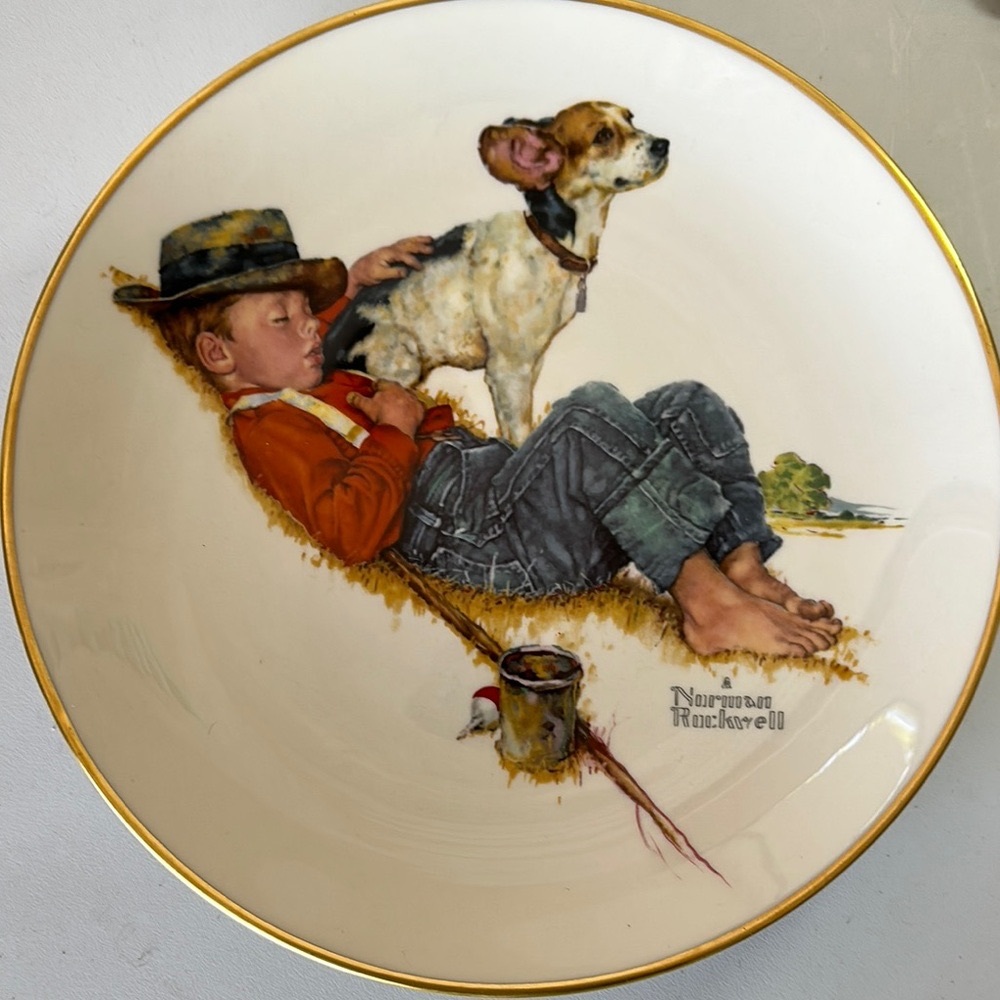 Norman Rockwell White and Gold Decorative Plate. 
13 total plates in this set.